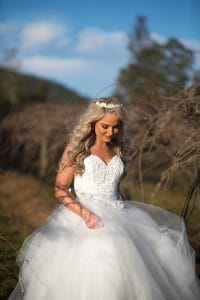 laughing bridal portrait in the grapevines at Stonehurst weddings