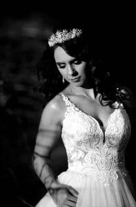 dark and moody bridal portrait with sun flair at Stonehurst weddings