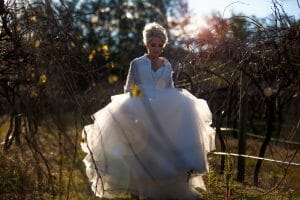 dark and moody bridal portrait with sun flair at Stonehurst weddings