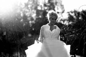 black and white bridal portrait with sun flair at Stonehurst Cedar Creek